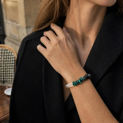 Close wrist view of the Verdant Circuit Malachite & Onyx Bracelet with green malachite, black onyx, clear quartz, pearl, and spotted stone sections