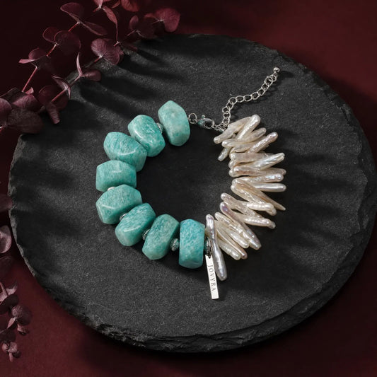 Flat-lay view of the Electric Tide Amazonite & Pearl Bracelet showing chunky blue-green amazonite and elongated white baroque stick pearls