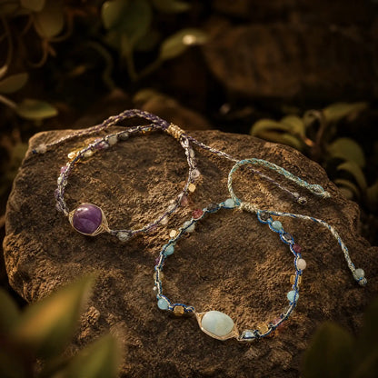 Blue amazonite wire-wrapped braided bracelet on natural wood