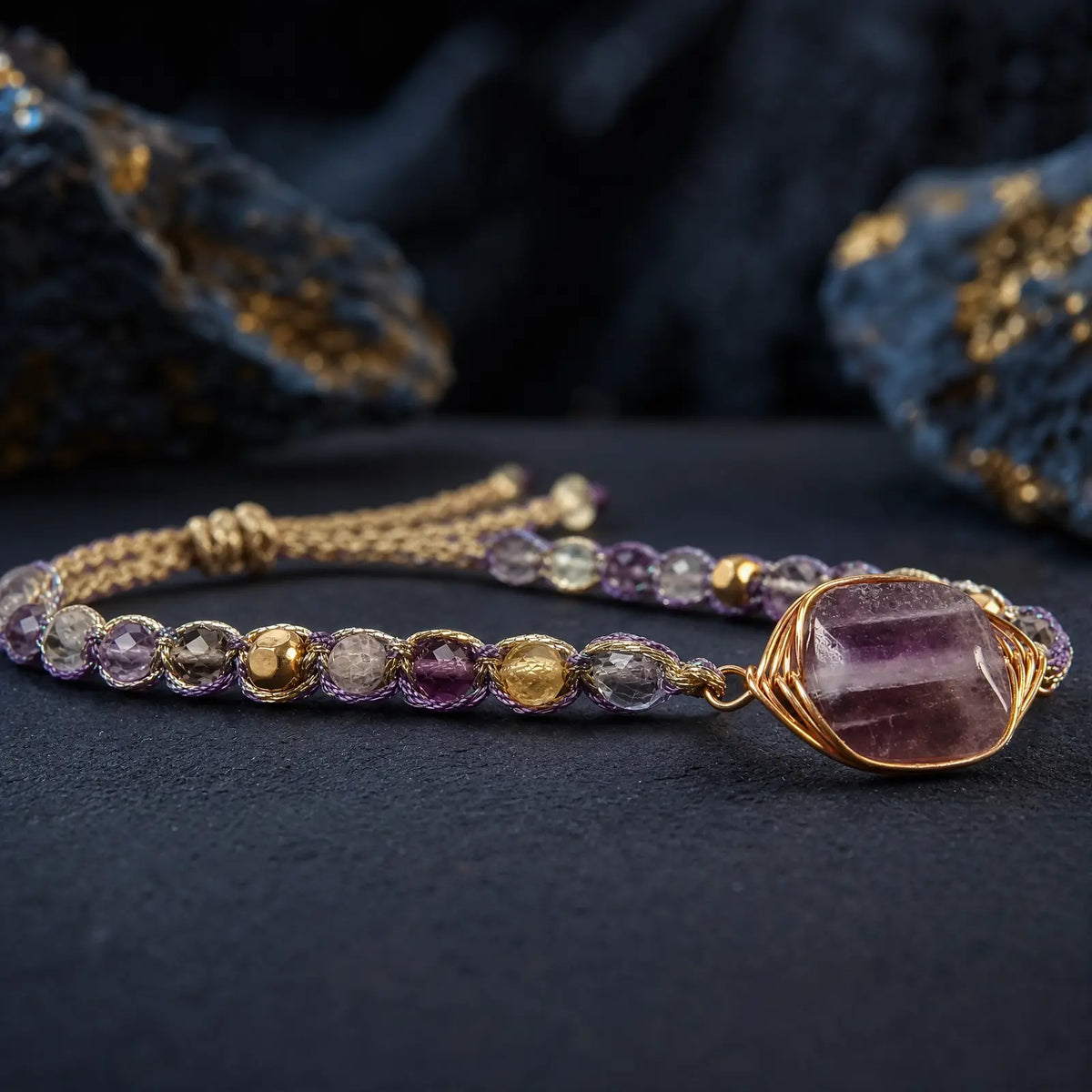 Wire-wrapped violet fluorite stone and braided bracelet detail