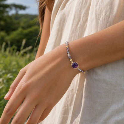 Violet fluorite braided bracelet worn on the wrist