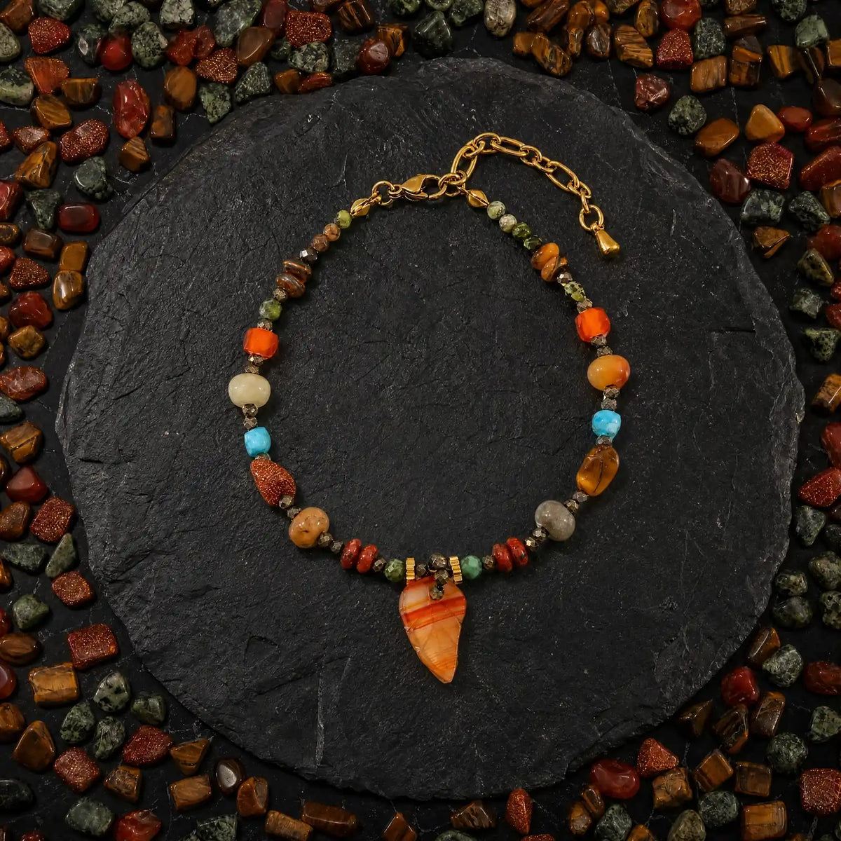Amber leaf mixed stone charm bracelet on dark slate