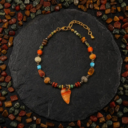 Amber leaf mixed stone charm bracelet on dark slate