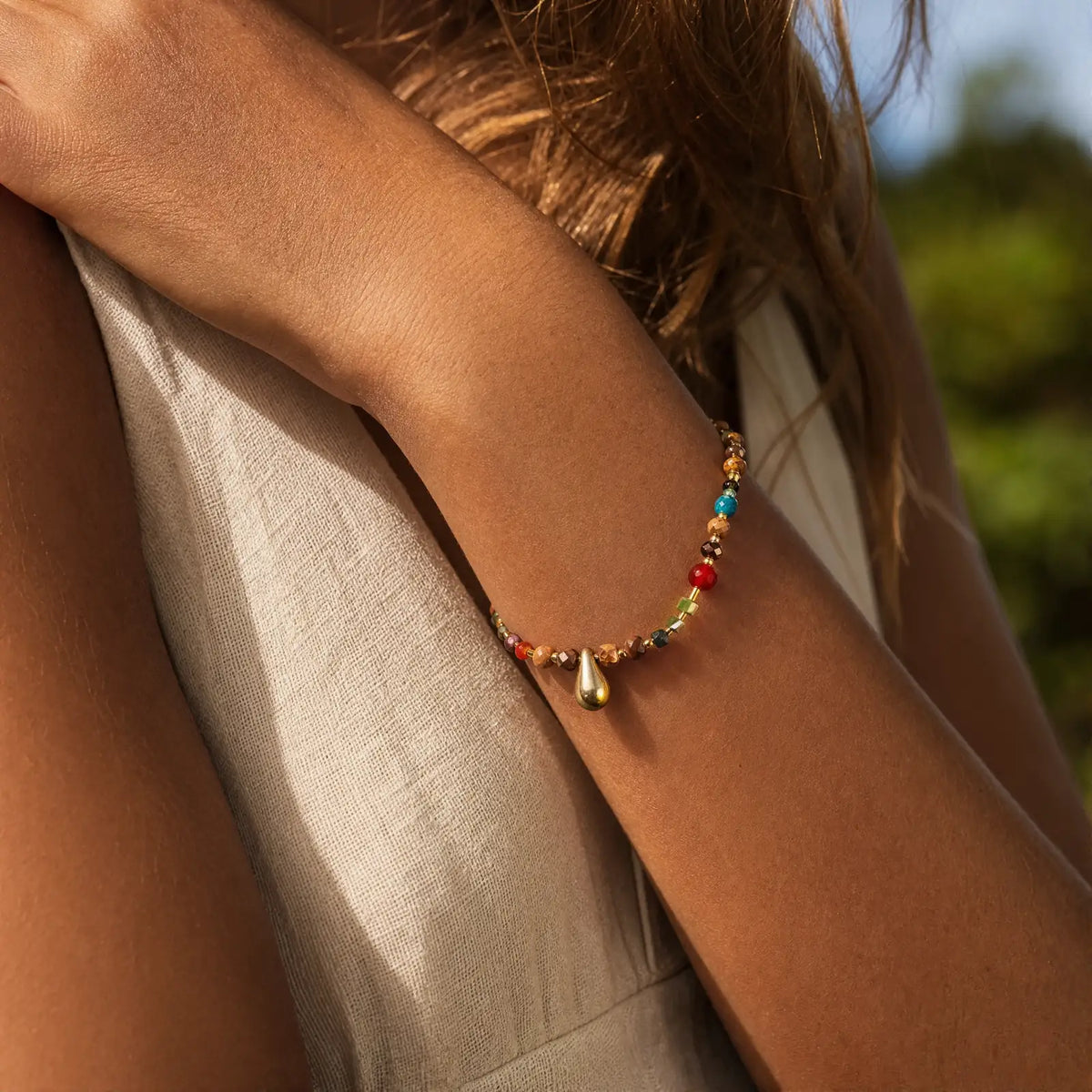 Tiger eye drop bracelet worn in warm natural light