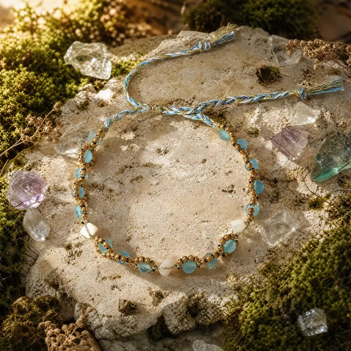 Natural cat's-eye braided bracelet on a mineral surface