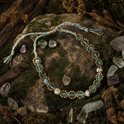 Blue cat's-eye bracelet arranged with moss and natural stones
