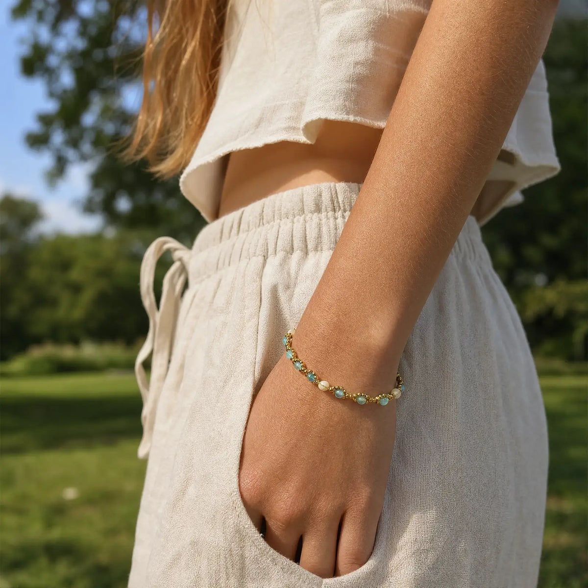 Blue cat's-eye bracelet worn with a casual summer outfit