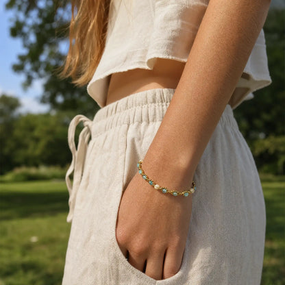 Blue cat's-eye bracelet worn with a casual summer outfit