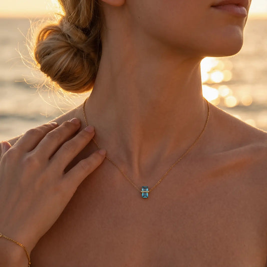 Diamond Birthstone Pendant Necklace worn at the neckline, lifestyle view 4.
