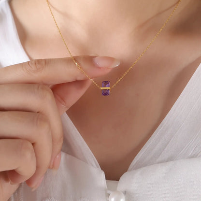 Diamond Birthstone Pendant Necklace worn at the neckline, lifestyle view 8.