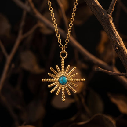 North star natural turquoise pendant necklace hanging from a gold-tone chain