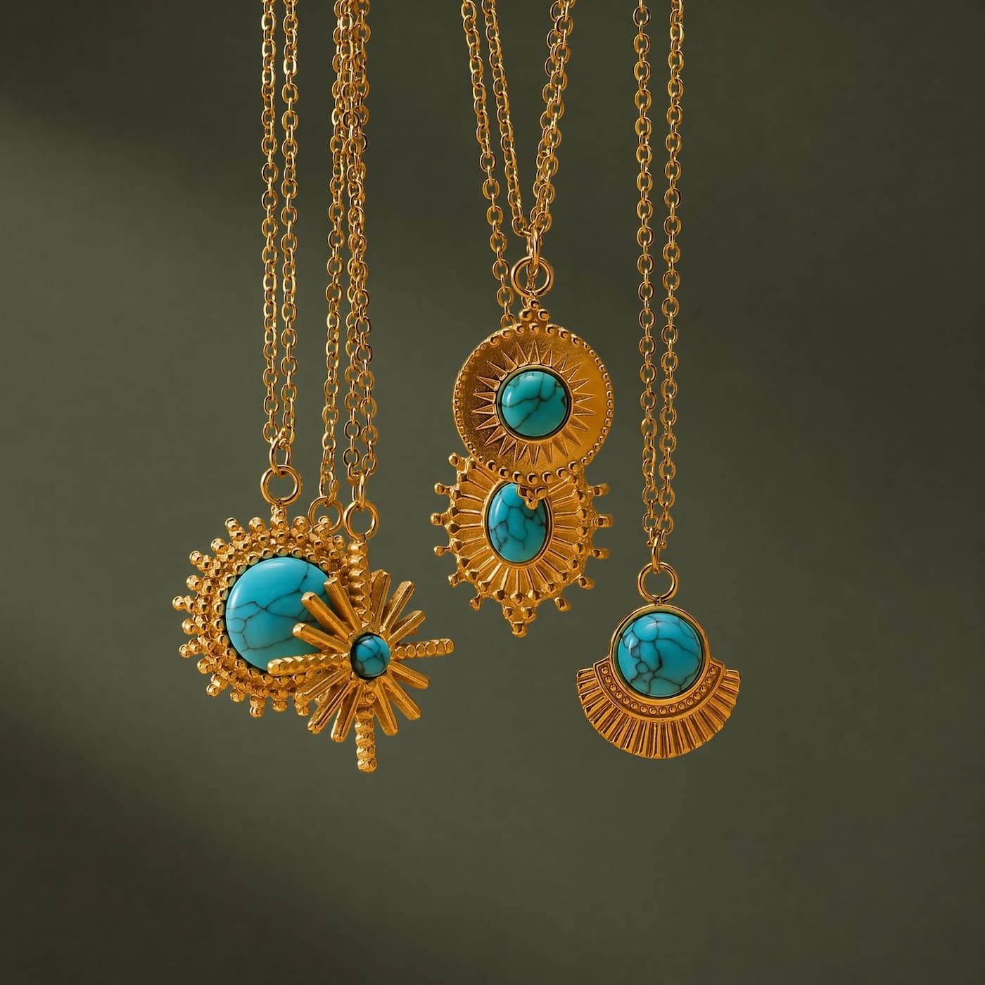 Three vintage-inspired turquoise pendant necklace styles hanging together.