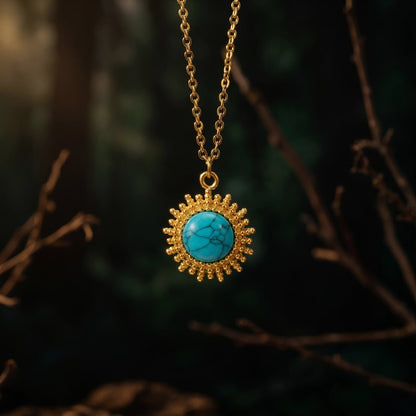 Vintage gold-tone natural turquoise pendant necklace hanging against a dark natural background