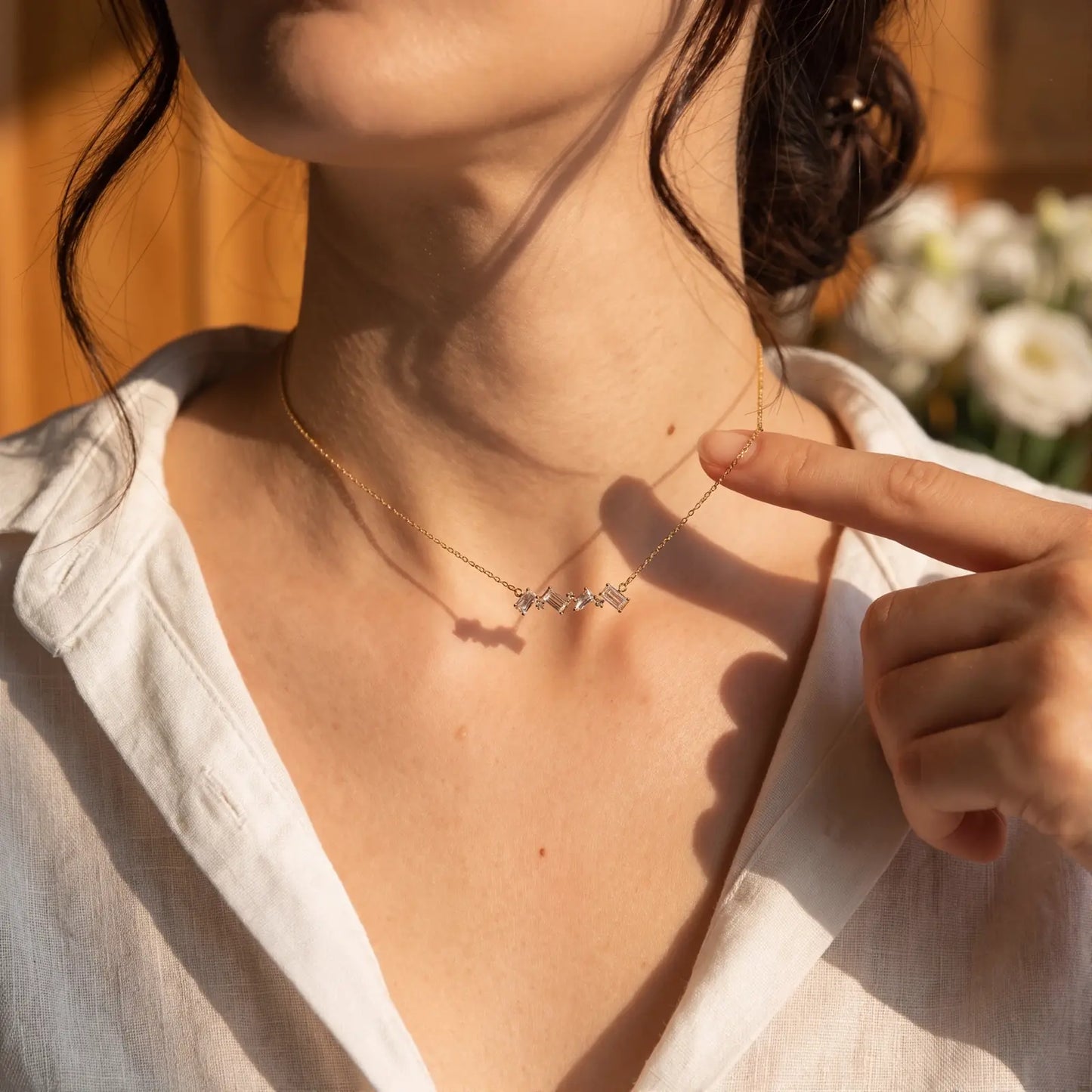 White Crystal Constellation Bar Necklace worn at the neckline, lifestyle view 6.