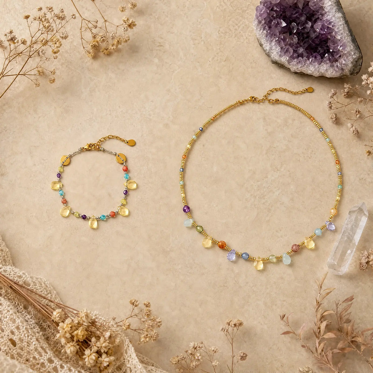 Natural stone necklace and bracelet set on a light mineral surface
