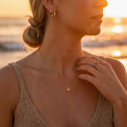 Sunray White Crystal Pendant Necklace worn at the neckline, lifestyle view 7.