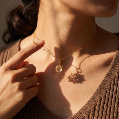Sunray White Crystal Pendant Necklace worn at the neckline, lifestyle view 4.