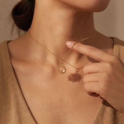 Sunray White Crystal Pendant Necklace worn at the neckline, lifestyle view 6.