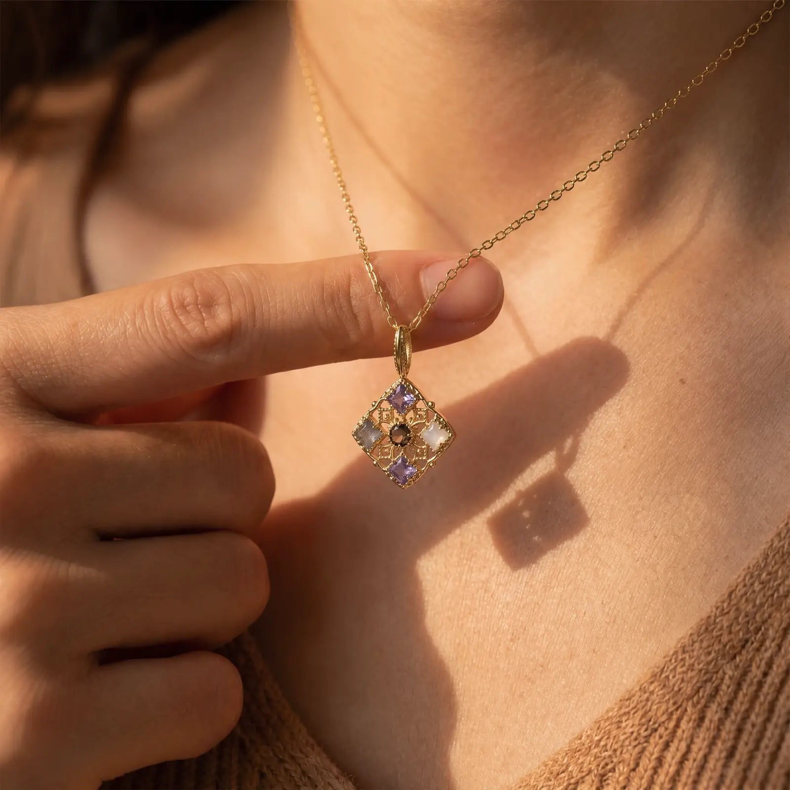 Filigree Window Mixed-Stone Pendant Necklace worn at the neckline, lifestyle view 9.