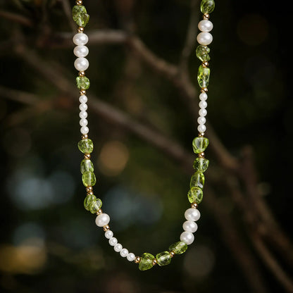 Peridot chip necklace with freshwater pearls and white shell beads