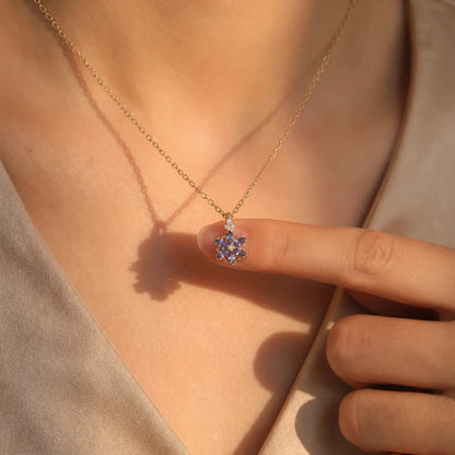 Blue Zircon Petal Cluster Necklace worn at the neckline, lifestyle view 3.
