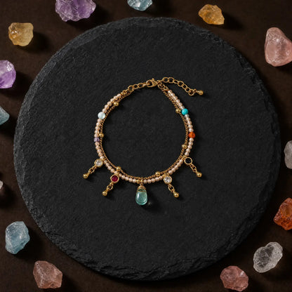 Natural stone bracelet with dangling bead accents