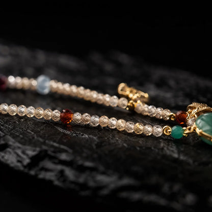 Close view of colorful beads and gold-tone necklace details