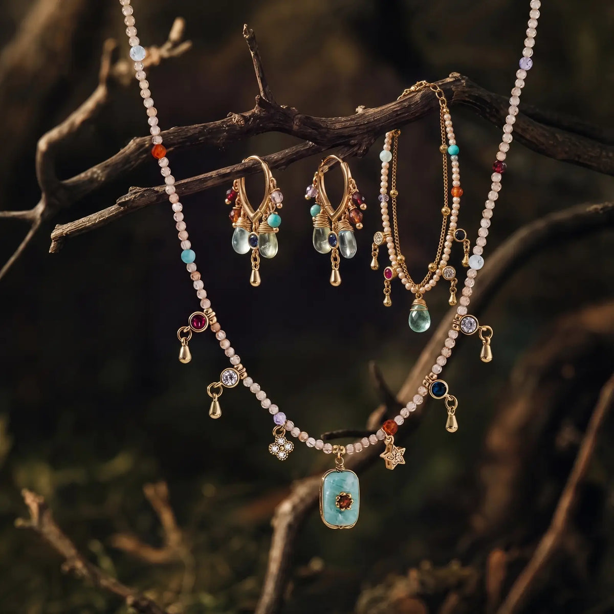 Amazonite necklace earrings and bracelet displayed together in a woodland setting