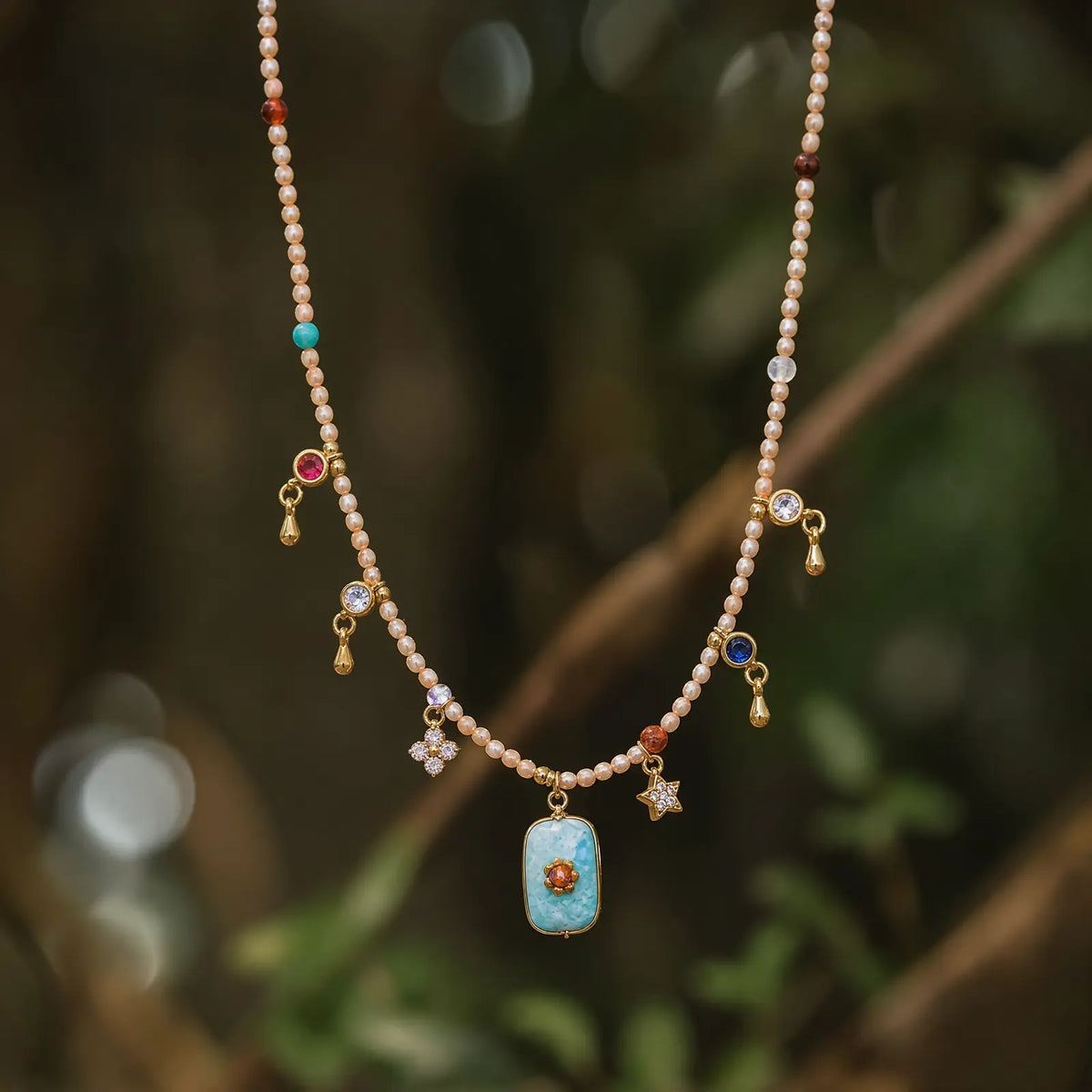Amazonite pendant necklace with delicate colorful fringe outdoors