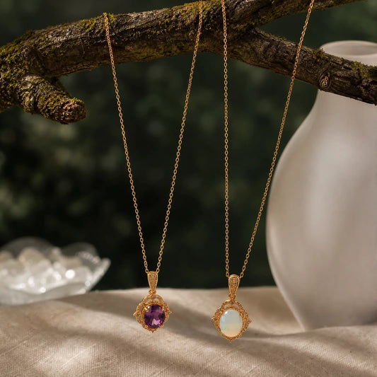 Amethyst and opal oval halo pendant necklaces displayed together