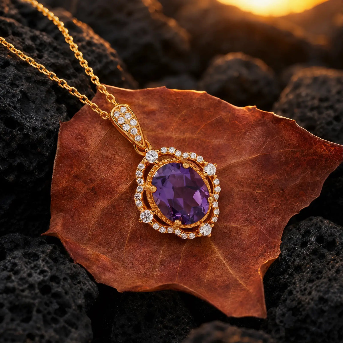 Amethyst oval halo pendant displayed on a red autumn leaf
