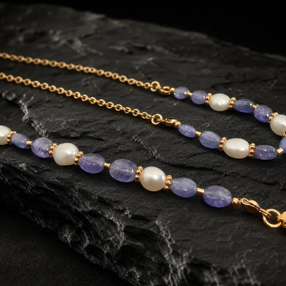 Close view of tanzanite beads freshwater pearls and gold-tone separators