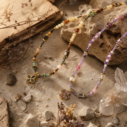 Lilac and tiger eye clover necklaces displayed together