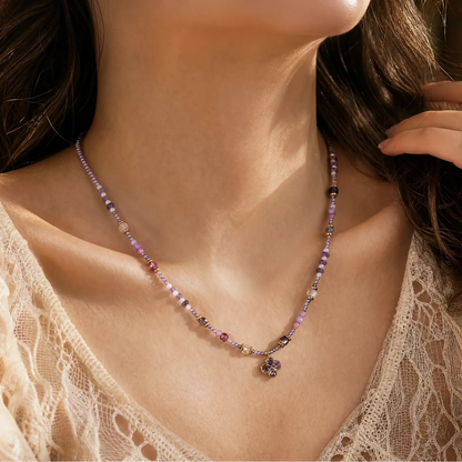 Lilac Clover necklace worn at the collarbone