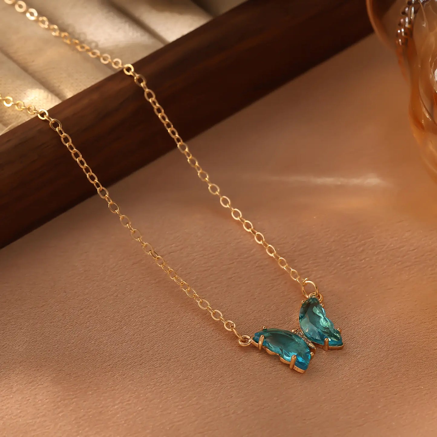 Iridescent Glass Butterfly Necklace, Blue color option.