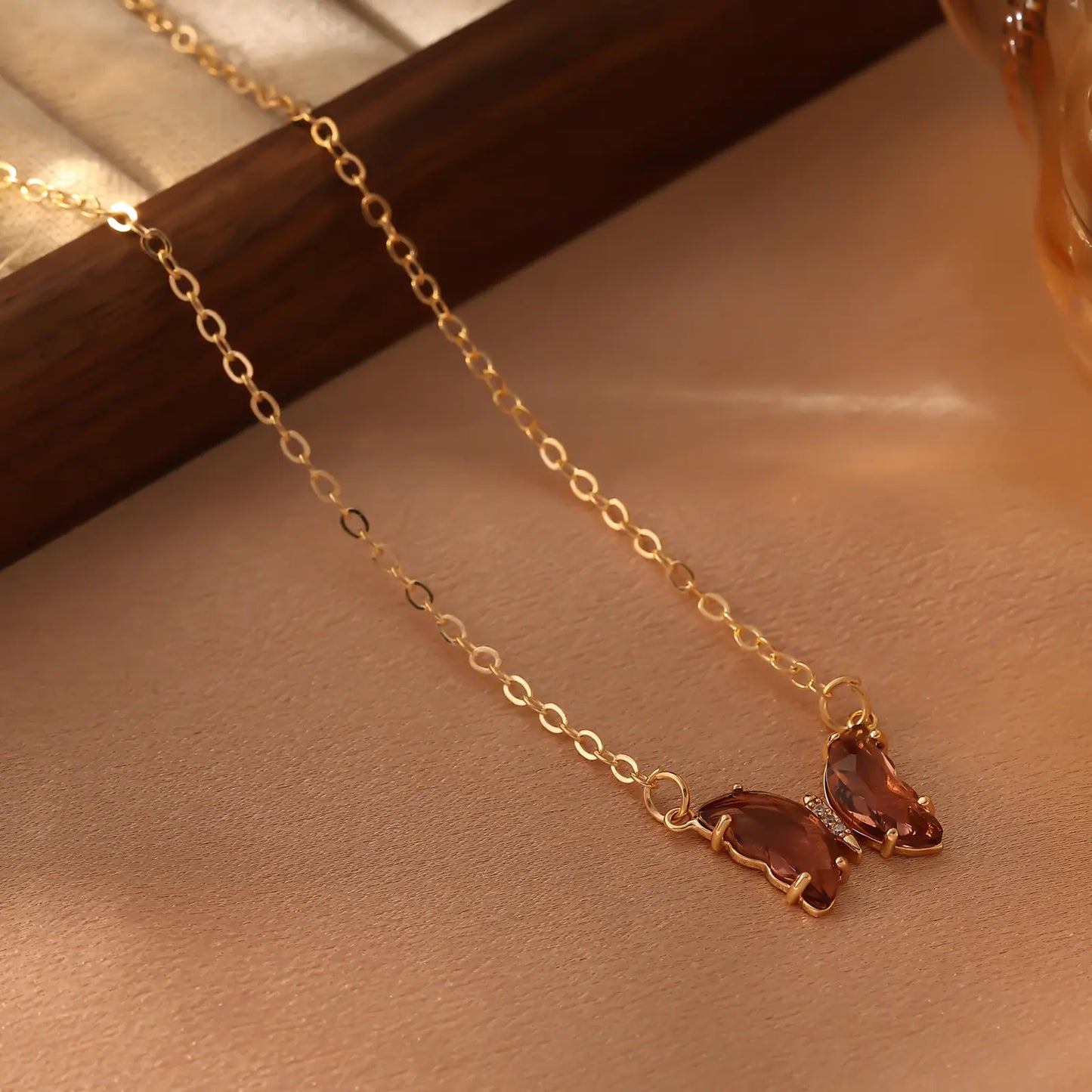 Iridescent Glass Butterfly Necklace, Brown color option.