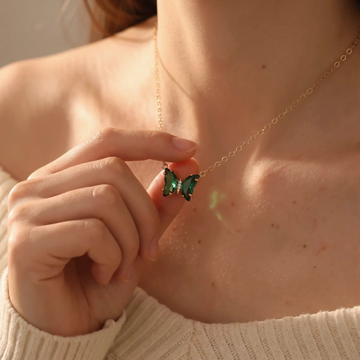 Iridescent Glass Butterfly Necklace worn at the neckline, lifestyle view 3.
