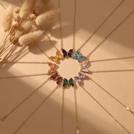 Iridescent Glass Butterfly Necklace worn at the neckline, lifestyle view 6.