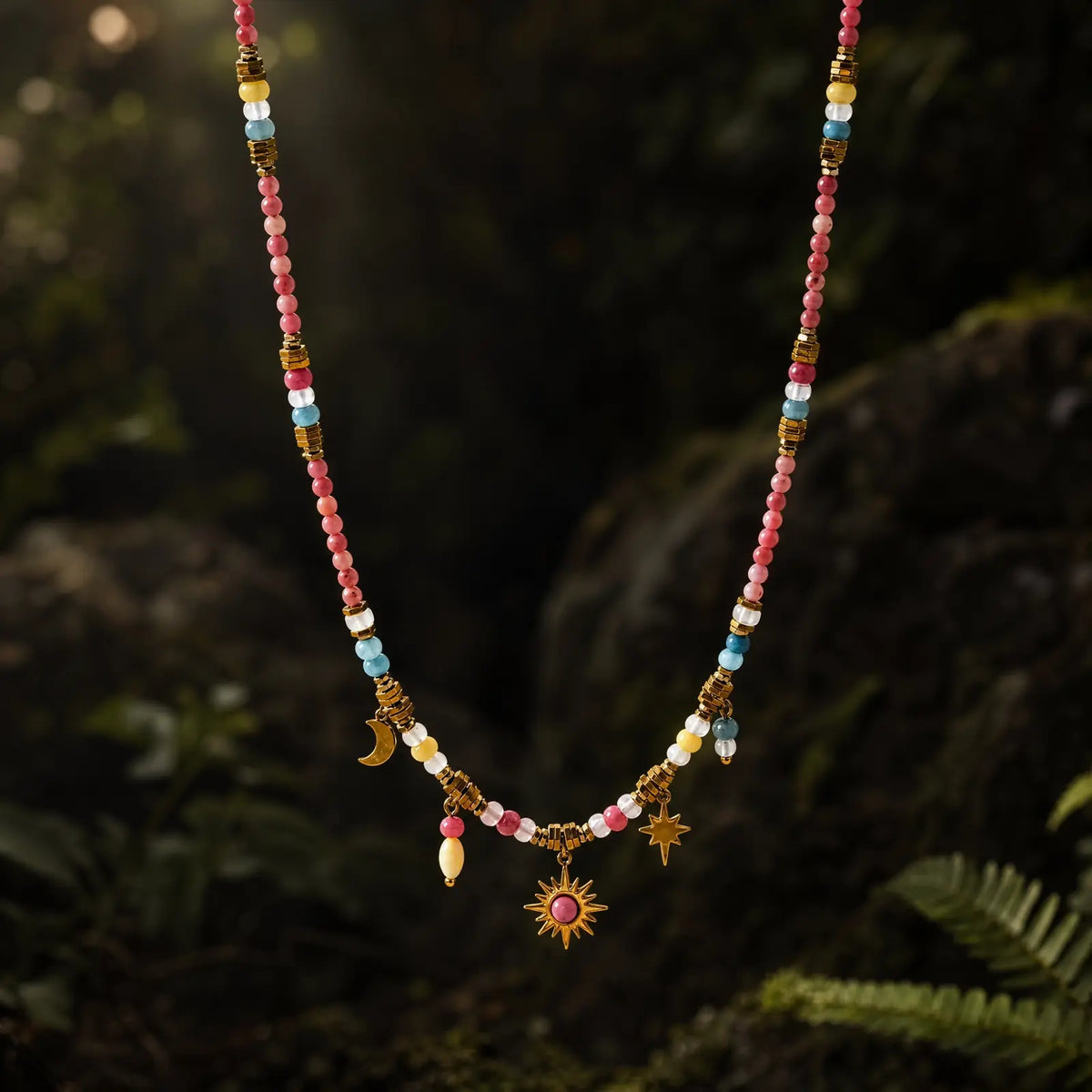 Rose Celestial natural stone necklace on a dark botanical background