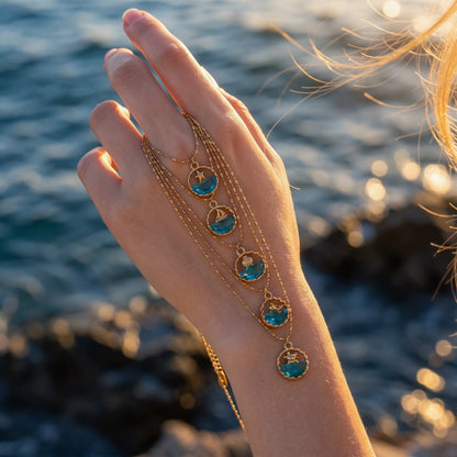 Ocean Motif Glass Pendant Necklace worn at the neckline, lifestyle view 5.