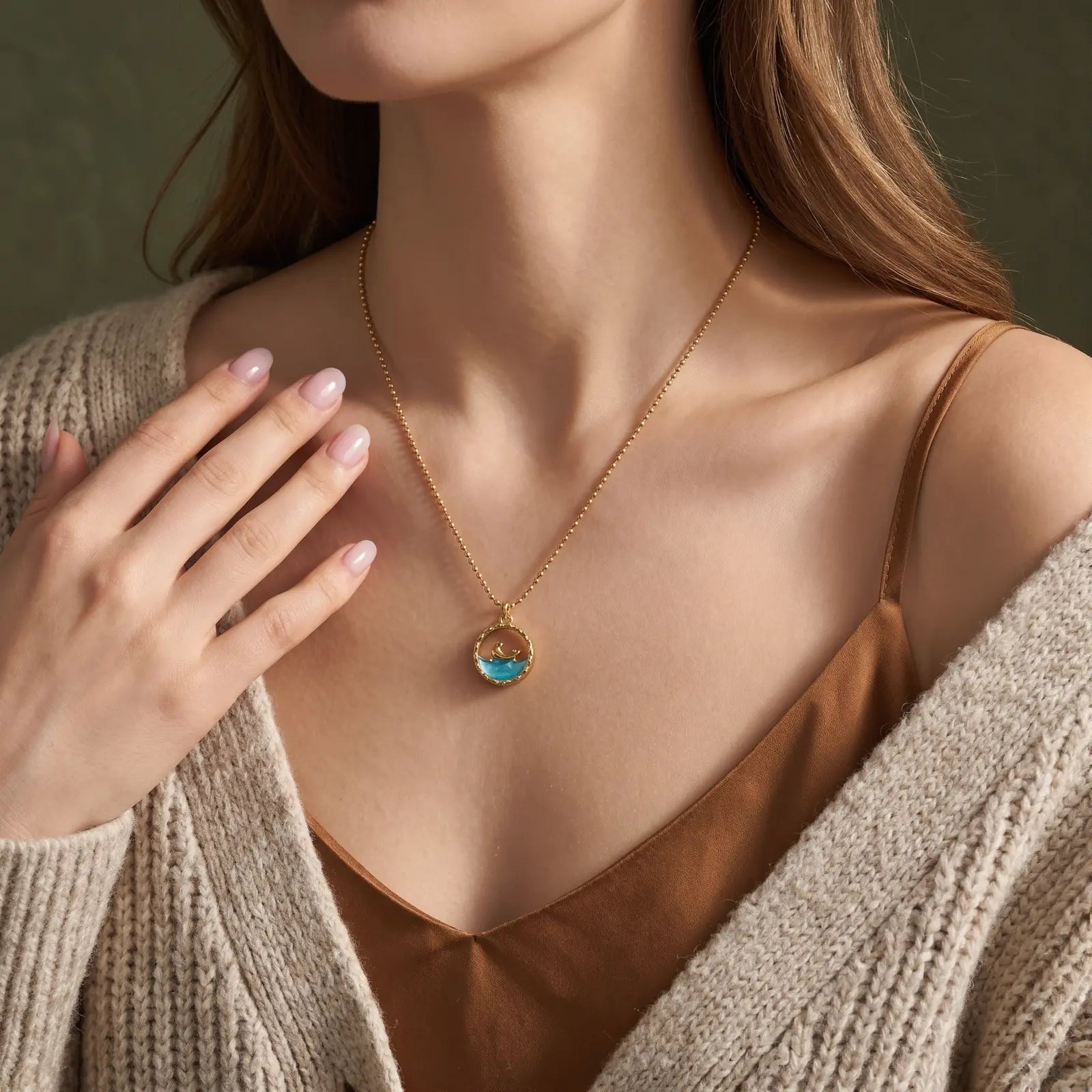Ocean Motif Glass Pendant Necklace worn at the neckline, lifestyle view 2.