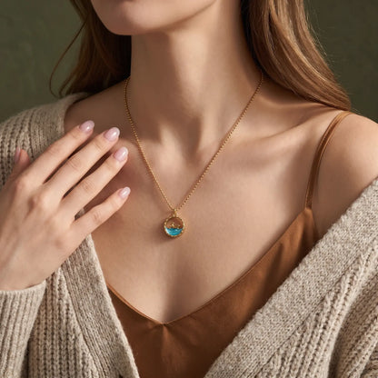 Ocean Motif Glass Pendant Necklace worn at the neckline, lifestyle view 2.