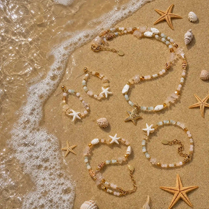 Starfish crystal necklace bracelet anklet and earrings arranged by the shore