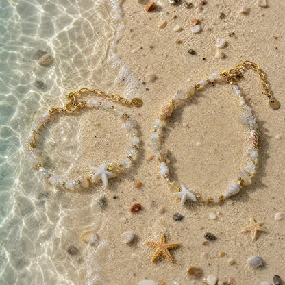 Coastal natural stone bracelets styled together in shallow water